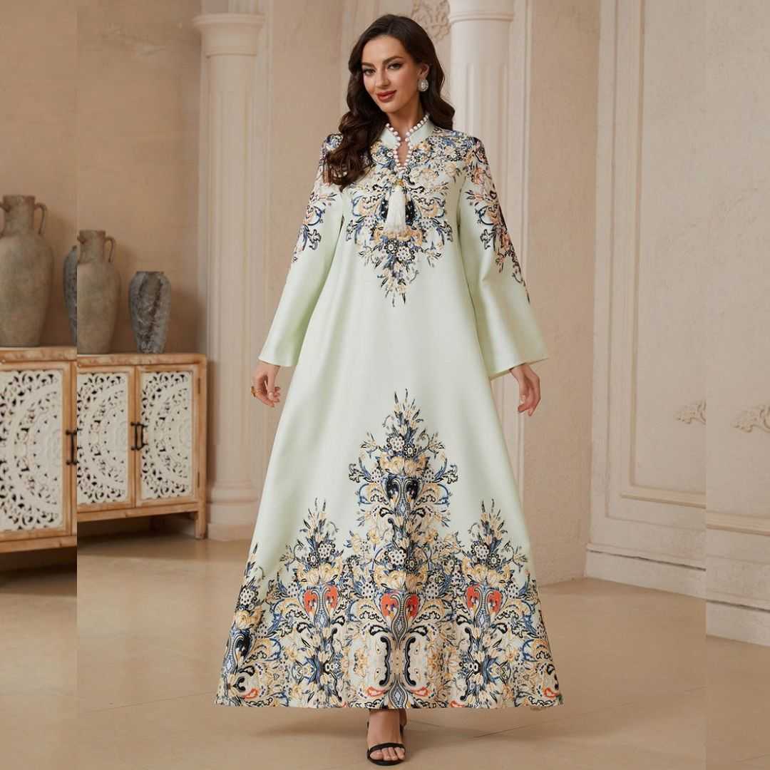 Elegant Printed Rhinestone A-Line Dress featuring digital print, delicate rhinestone & tassel detailing. Soft four-way stretch fabric, flattering A-line silhouette and large hem. Mid-length, long sleeve. Sizes M, L, XL.