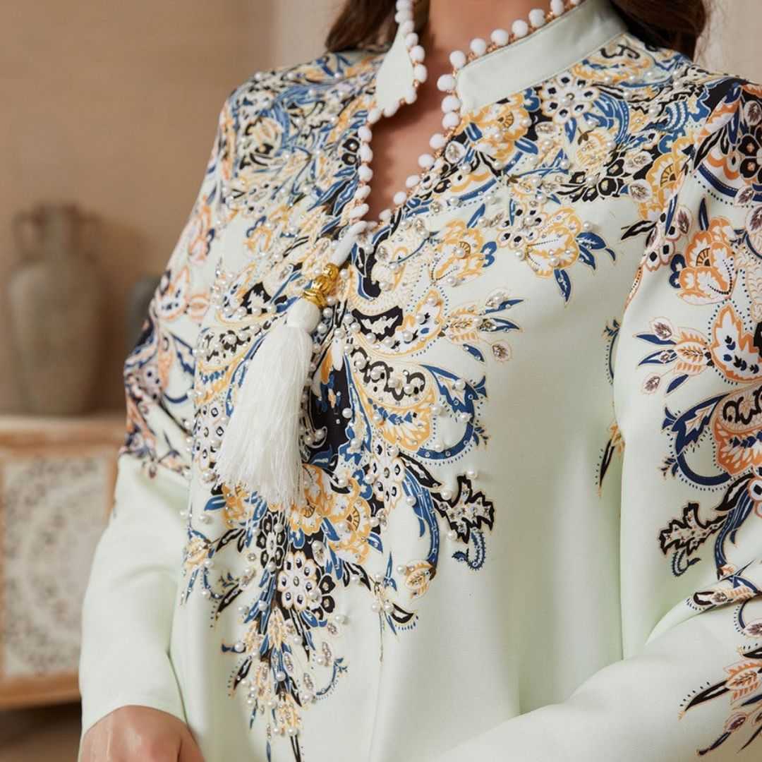 Elegant Printed Rhinestone A-Line Dress featuring digital print, delicate rhinestone & tassel detailing. Soft four-way stretch fabric, flattering A-line silhouette and large hem. Mid-length, long sleeve. Sizes M, L, XL.