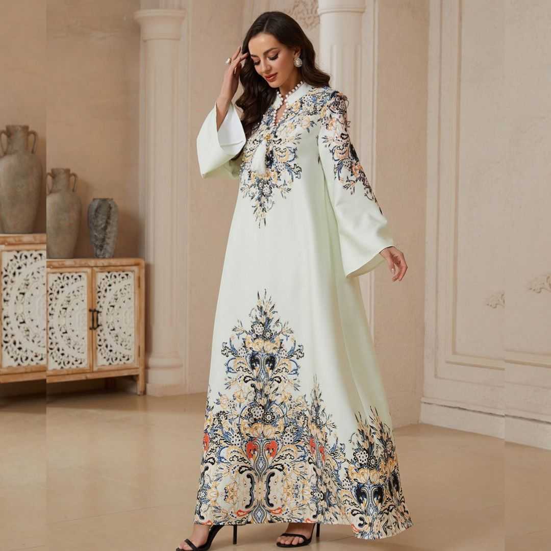 Elegant Printed Rhinestone A-Line Dress featuring digital print, delicate rhinestone & tassel detailing. Soft four-way stretch fabric, flattering A-line silhouette and large hem. Mid-length, long sleeve. Sizes M, L, XL.